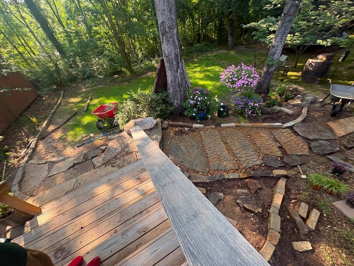 Flagstone path under construction in a wooded backyard