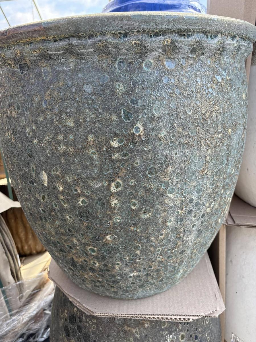 Close-up of a speckled glazed ceramic planter